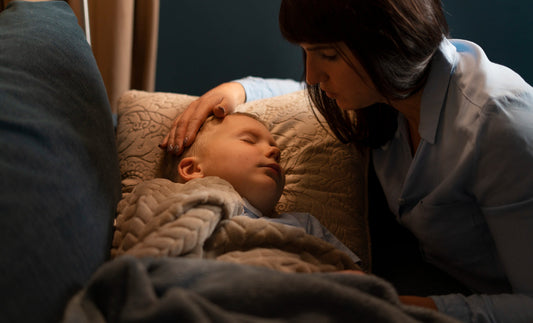 Baby sleeping with peaceful expression, representing childhood sleep apnea awareness.